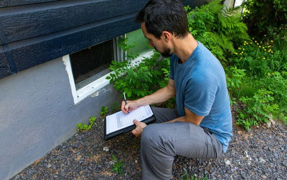 Man Inspecting Home